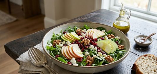 Gourmet Apple Walnut Salad with fresh arugula, sliced organic apples, walnuts, dried cranberries, and feta cheese, drizzled with NuEats Extra Virgin Olive Oil